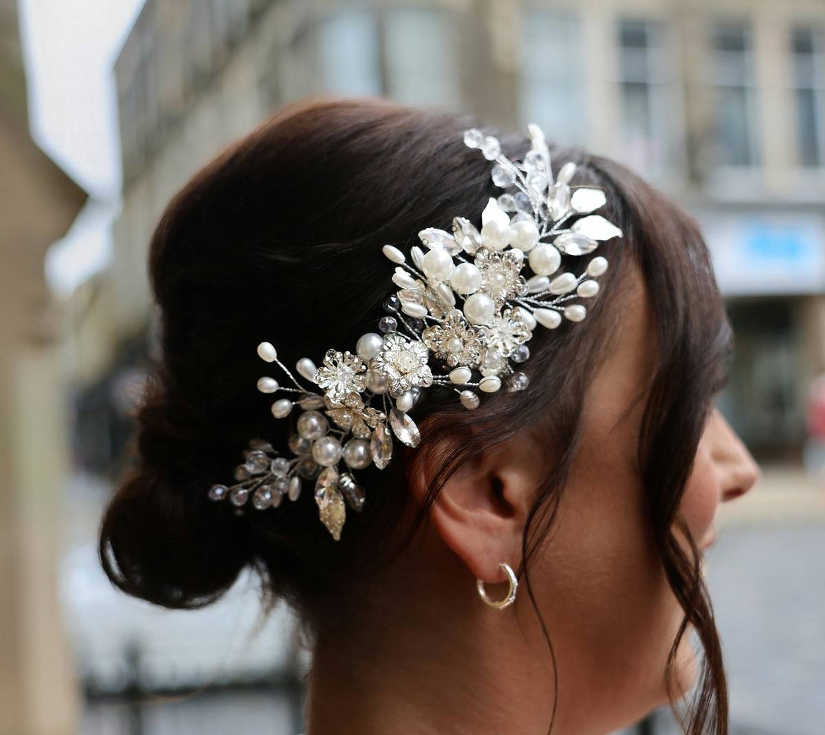 Woman wearing a velvet hair headband achieving Professional Finish with sleek ponytail